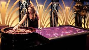 Live dealer at a Diamond Empire blackjack table streaming to mobile device